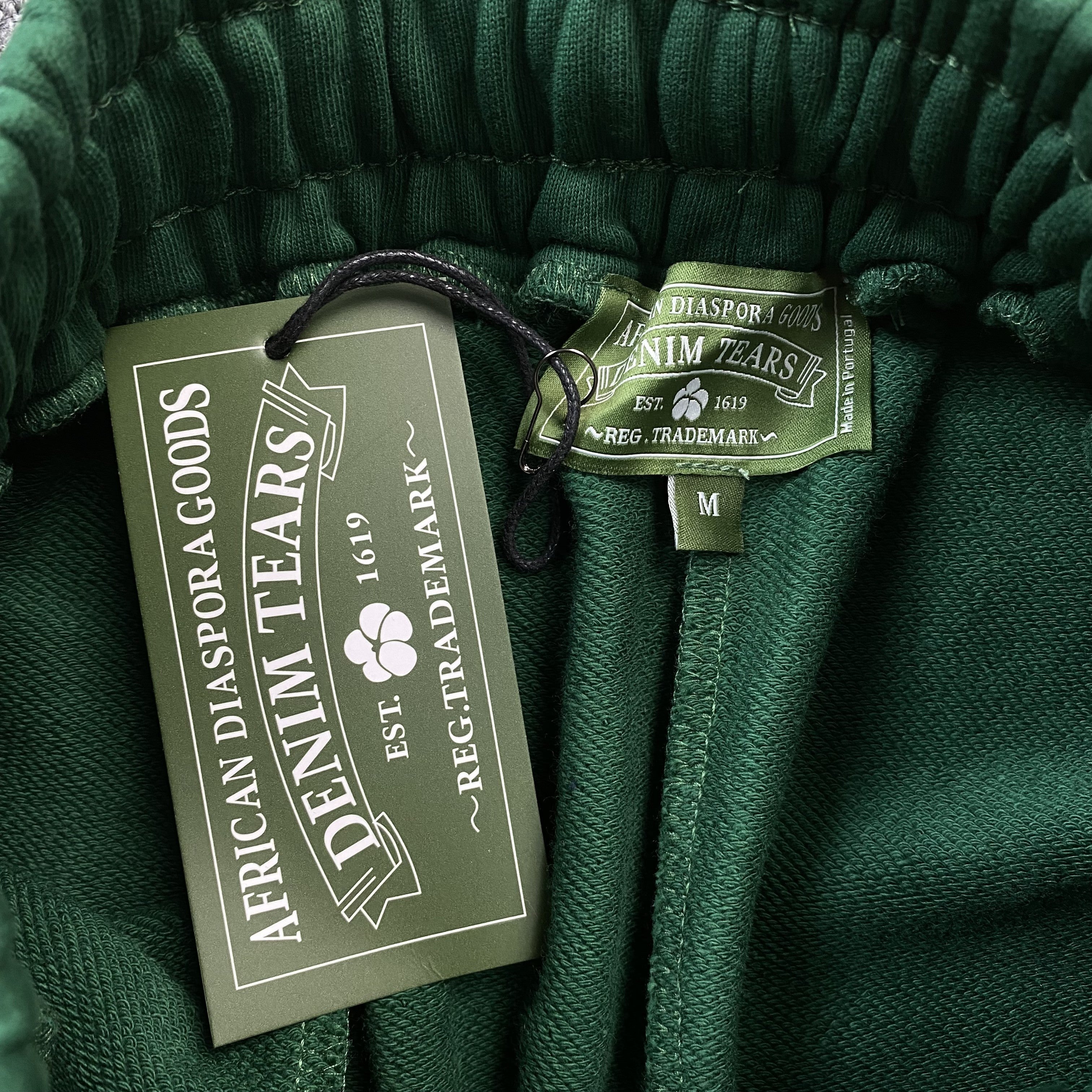 DENIM TEARS COTTON WREATH SWEATPANTS DARK GREEN