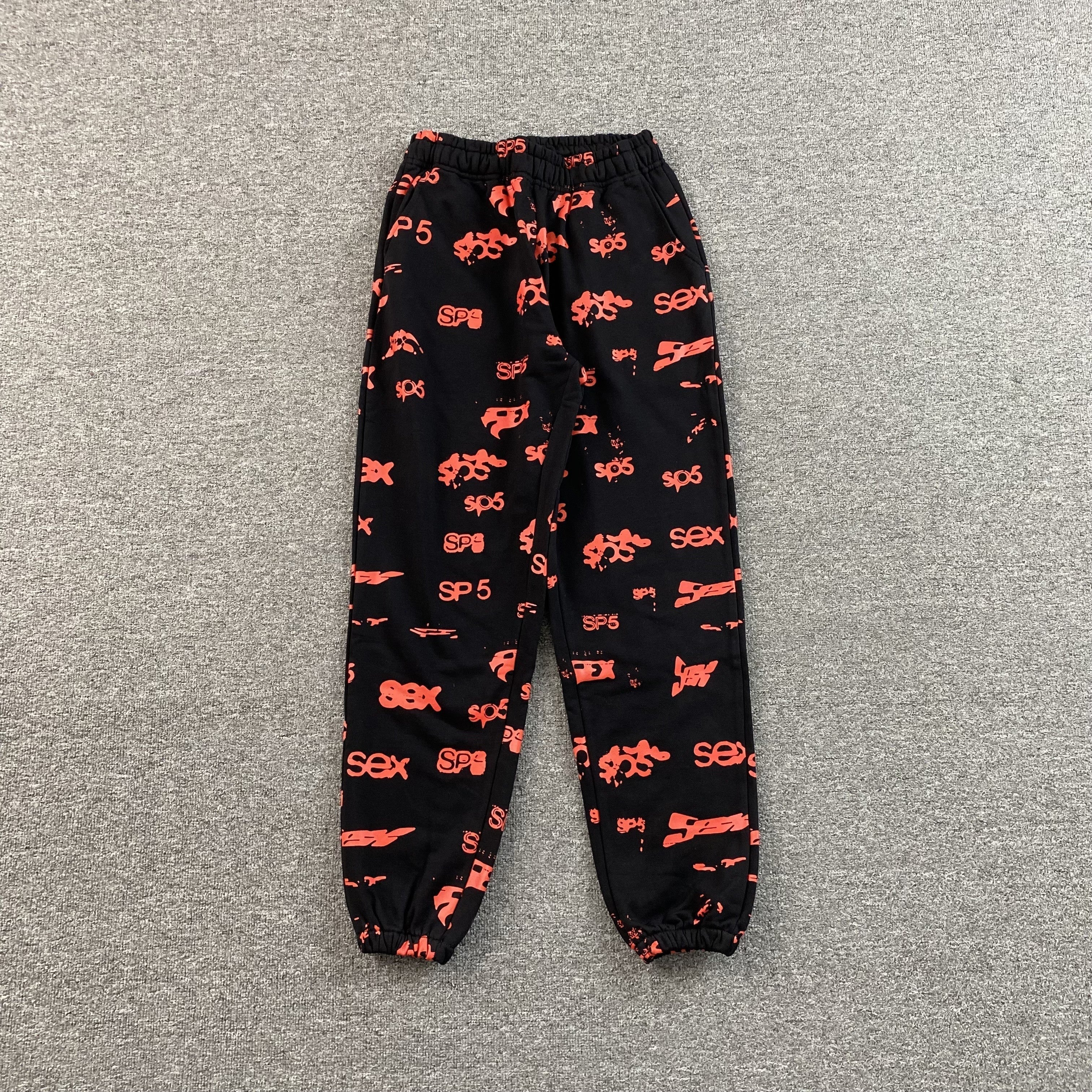 SP5DER SEX AOP SWEATPANTS BLACK