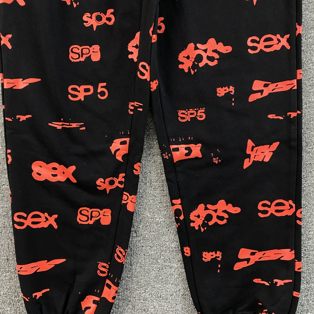 SP5DER SEX AOP SWEATPANTS BLACK